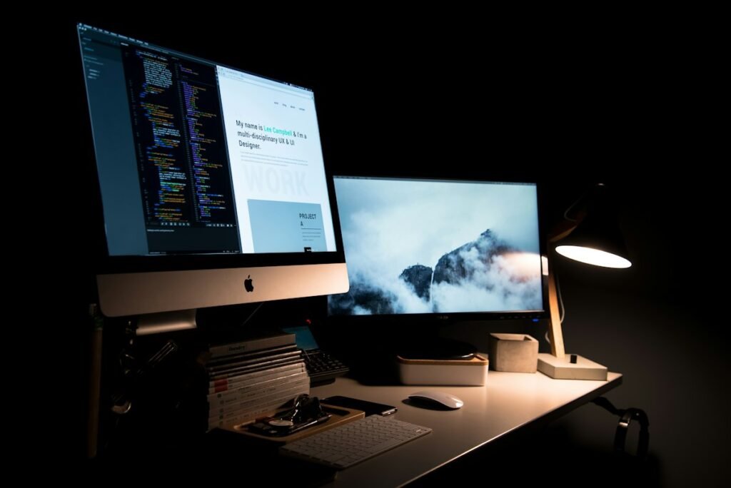 Web designer working on a laptop with coffee